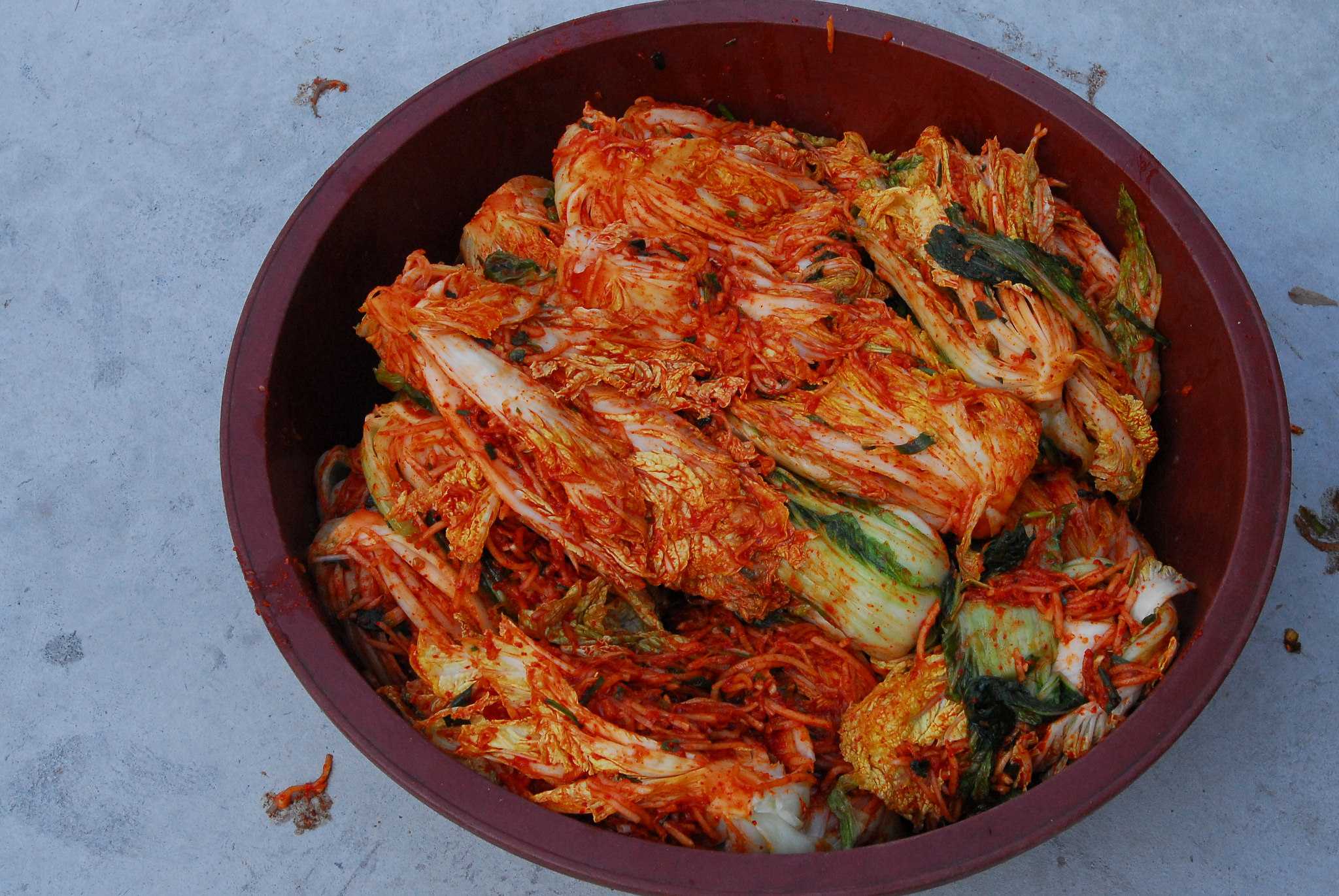 Приготовление капусты кимчи. Кимчи корейский. Кимчи корейское блюдо. Кимчи (острая корейская капуста). Национальное блюдо Кореи Южной кимчхи.